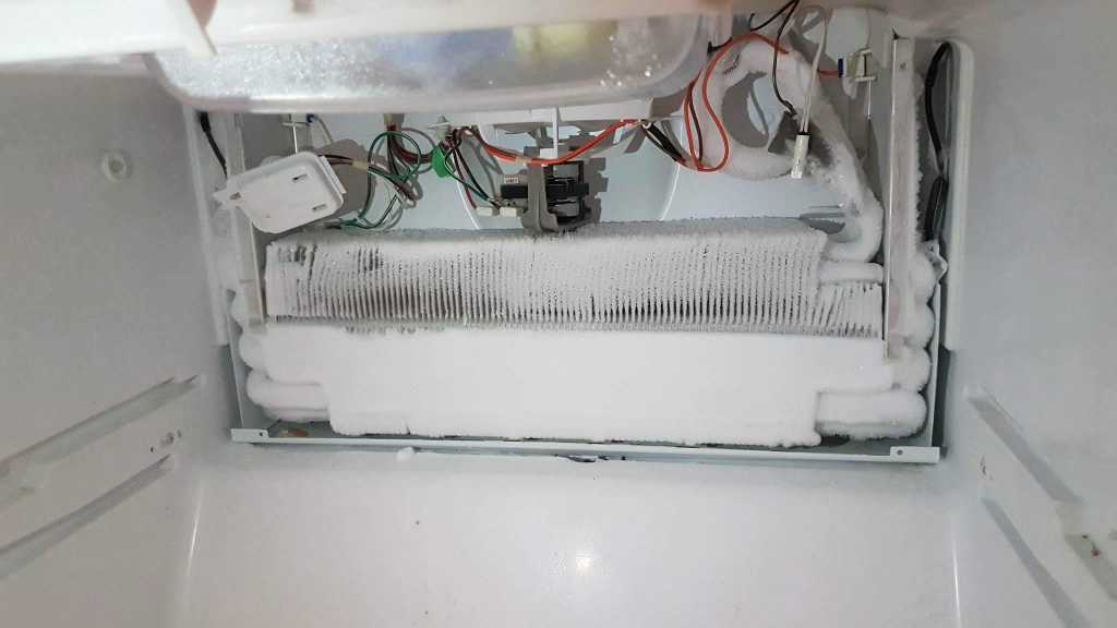 broken refrigerator covered in ice - fridge repair toronto